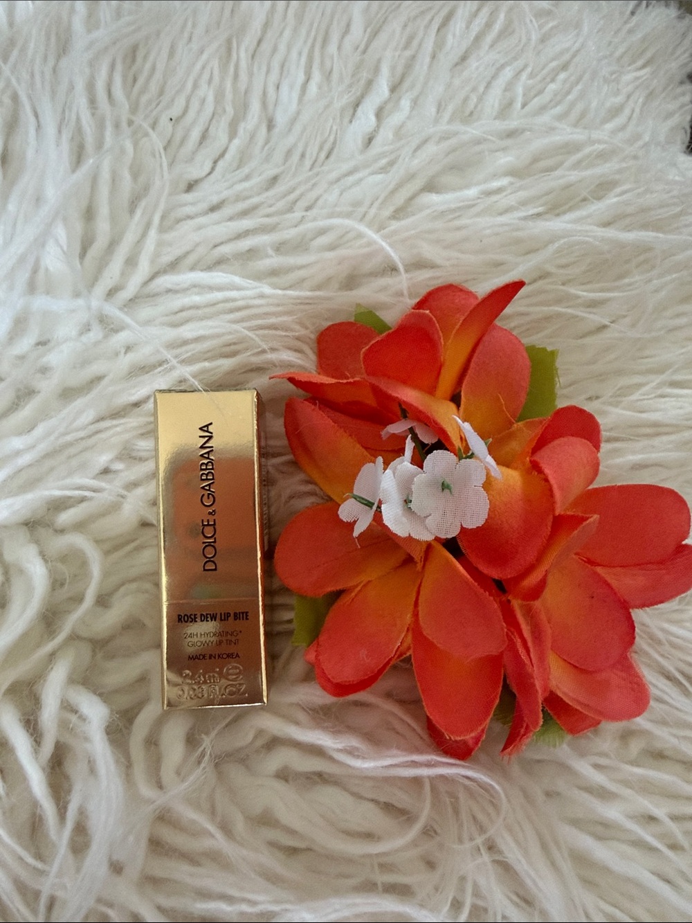 Dolce & Gabbana Lip Bite in Metallic Gold with Orange-Red Floral Accent
